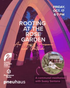 Colorful inflatable arches illuminate a gathering for a communal meditation event in a park.